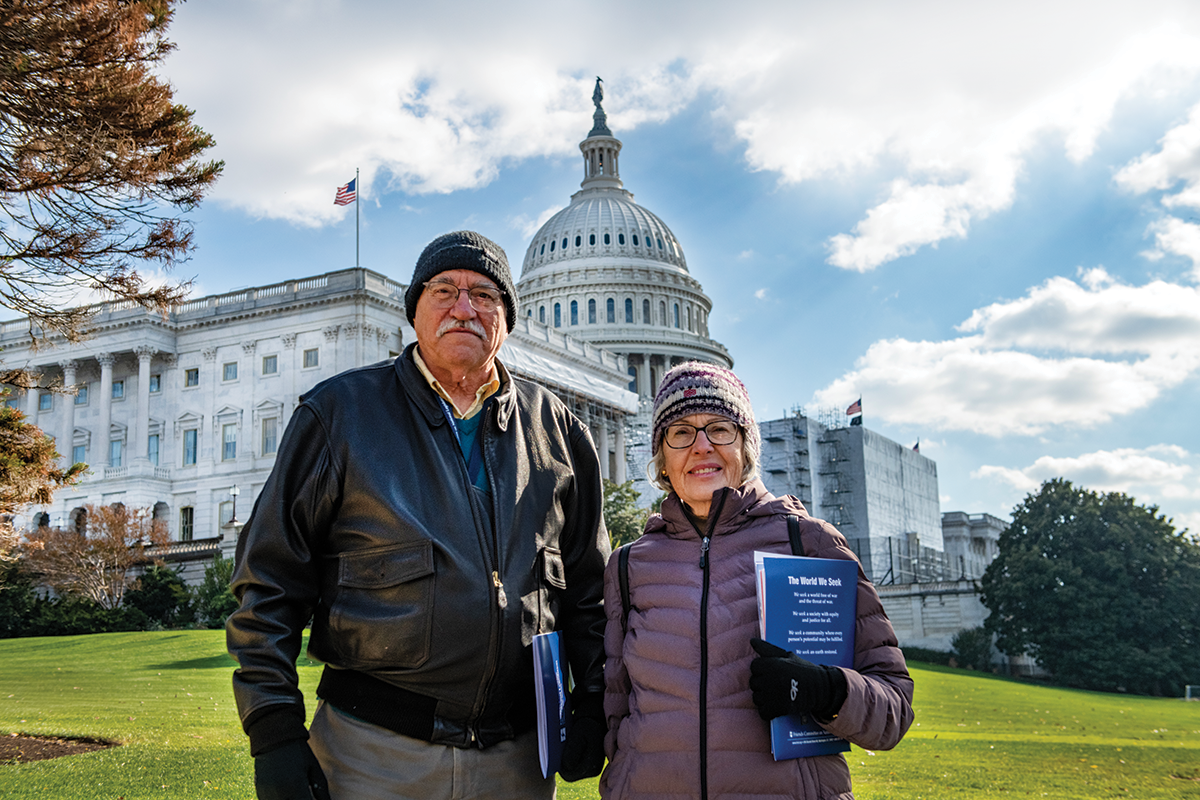 Advocates stand in front of Capitol building at Annual Meeting 2022