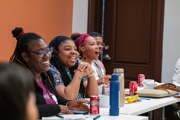 Organizers talking at the Diaspora Organizing Gathering in 2024
