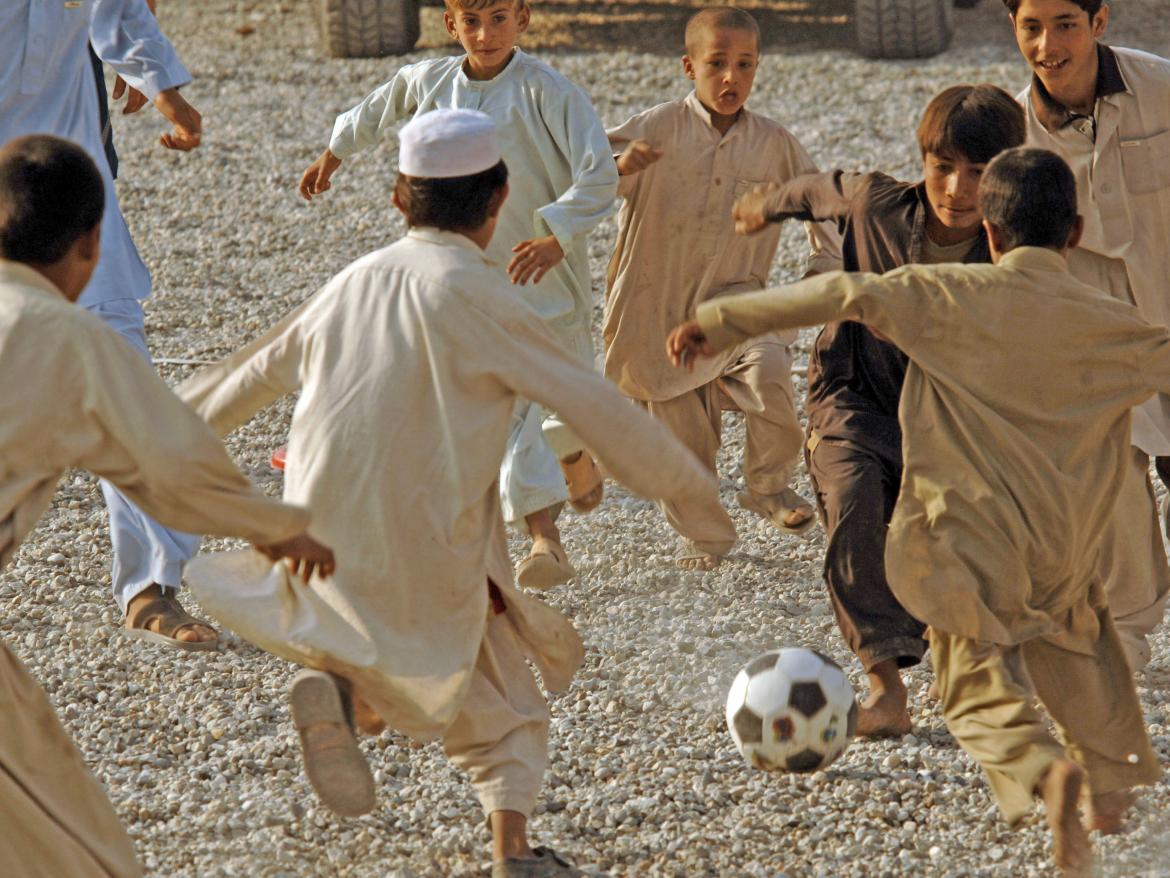 Children playing soccer.