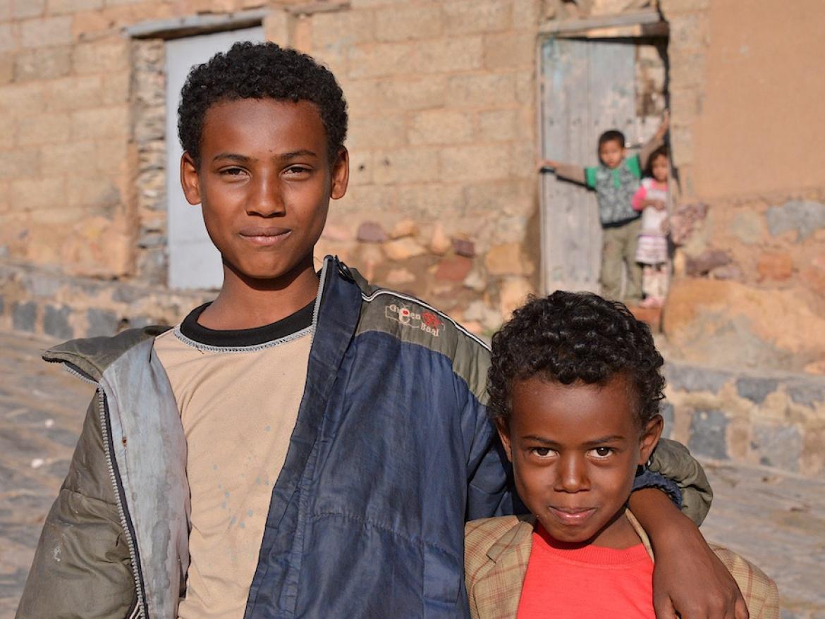 Two brothers pose in street in Mahweet, Yemen