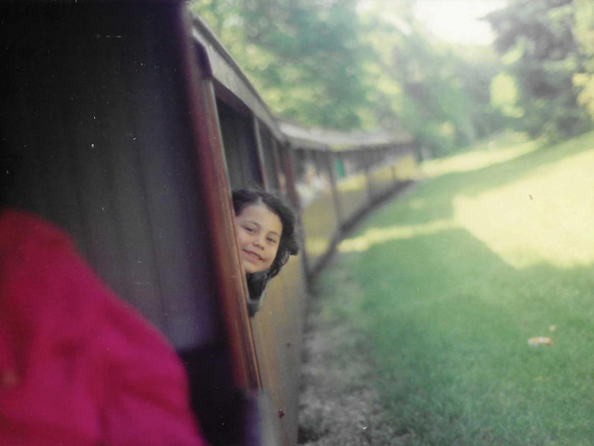 Young Portia rides a train.