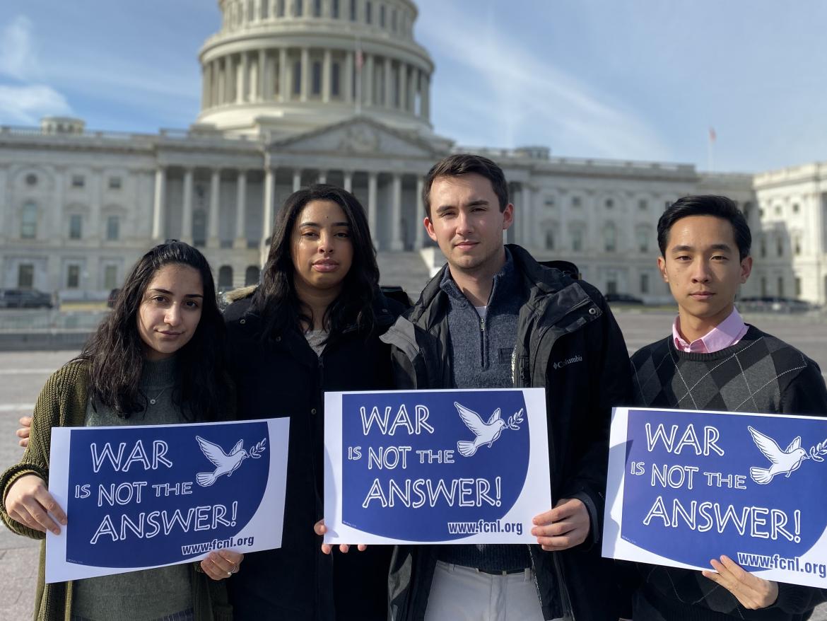 FCNL advocates hold signs in front of U.S. Capitol that declare "War is Not the Answer"