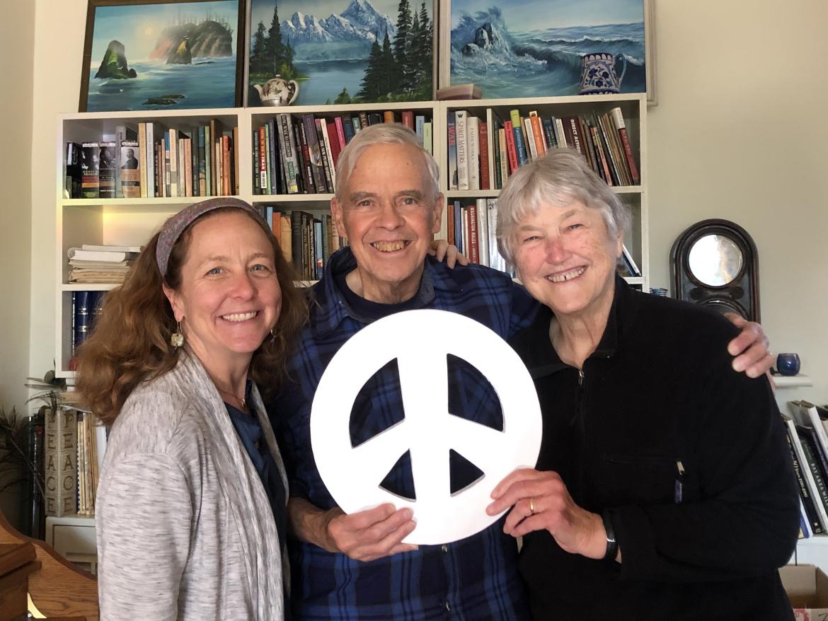 David and Jan Hartsough with Bridget Moix holding peace sign