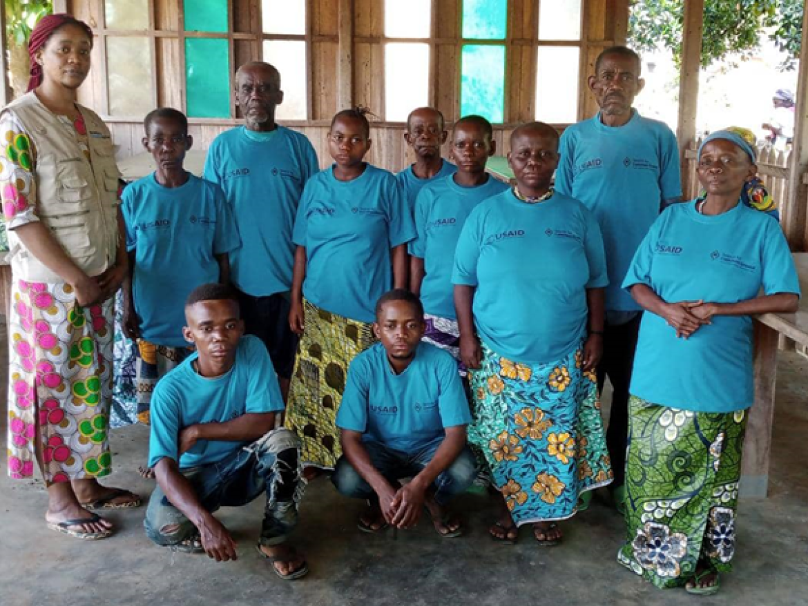 A family photo of Autochton people in Nduye, Democratic Republic of the Congoafter monitoring and evaluation focus groupStaff from Democratic Republic of the Congo (DRC)