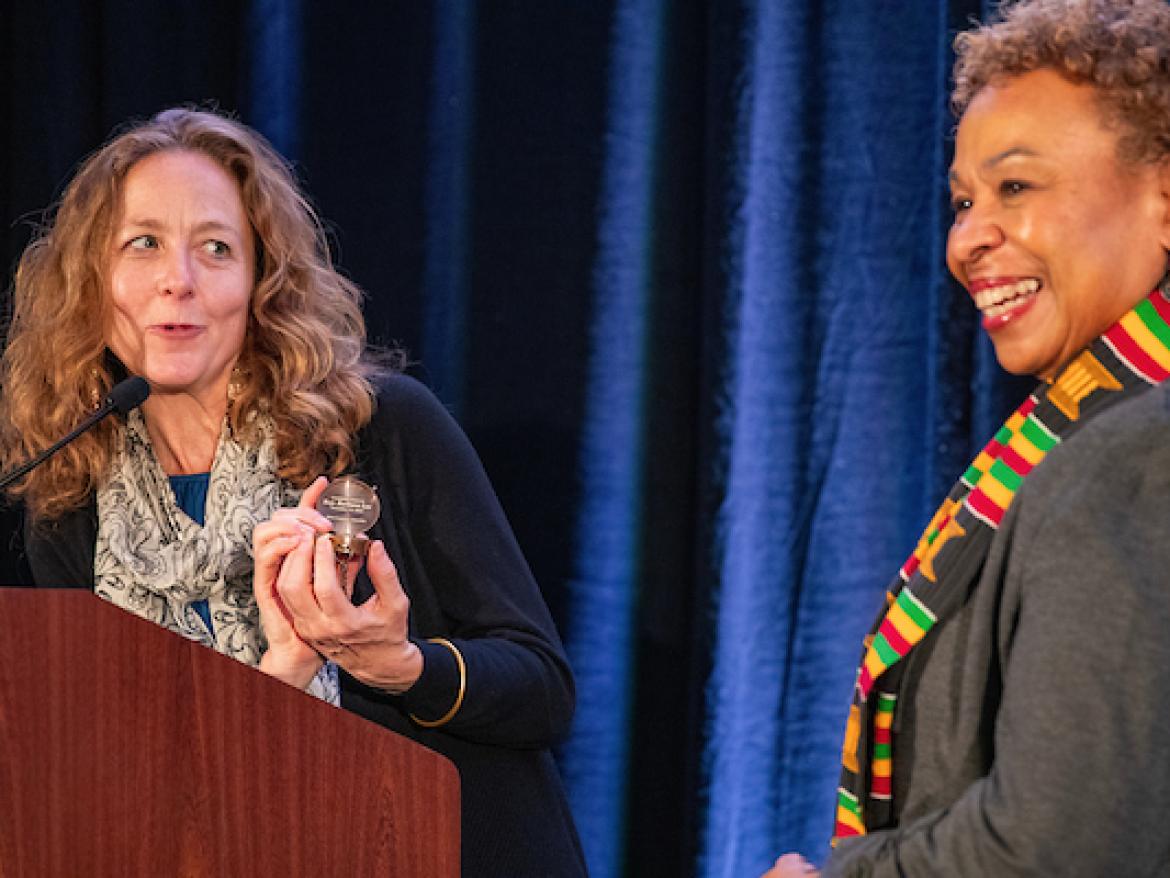Bridget Moix presenting Rep Barbara Lee with the Compass Award, QPPI 2024