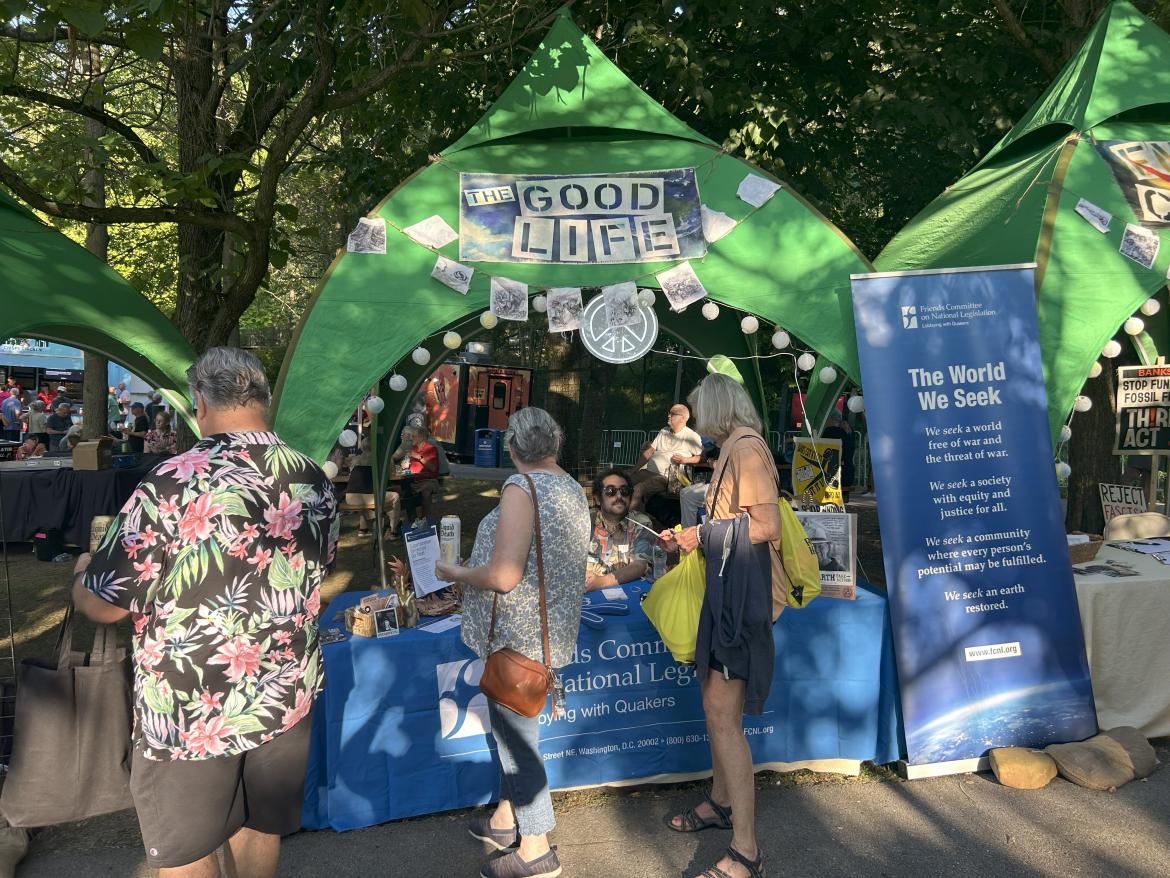 FCNL's Wesley Pinkham greets concertgoers at our table.