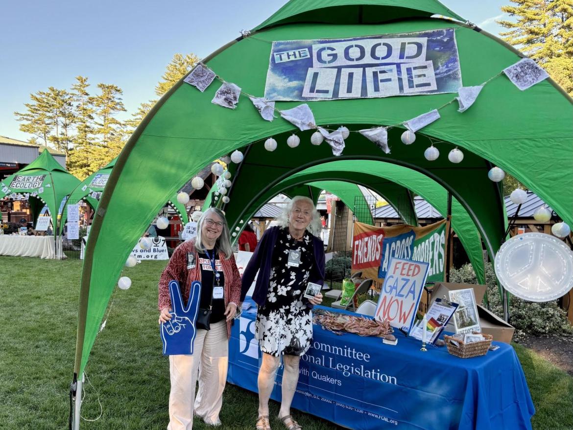 FCNL volunteers standing in front our table at a Neil Young concert. 