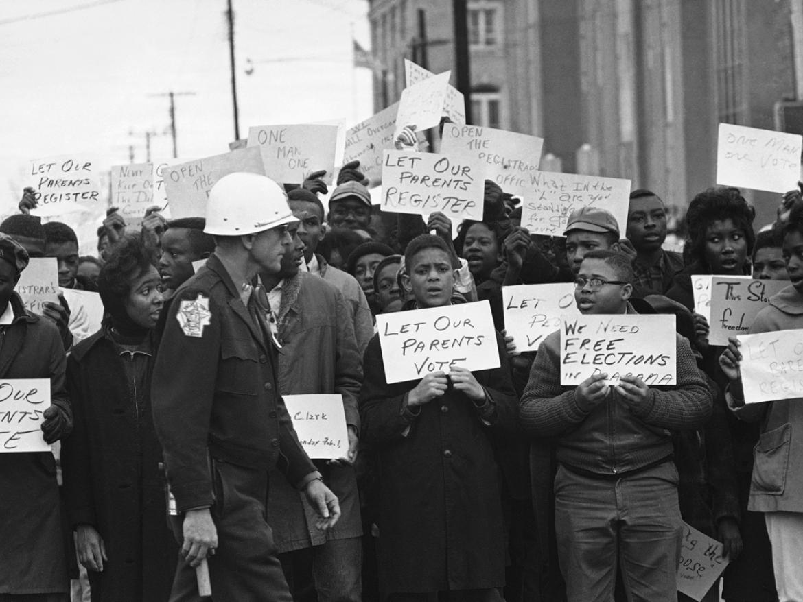 Youth carrying signs for voting rights