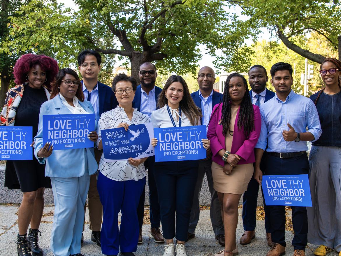 diaspora organizers with "Love Thy Neighbor" signs