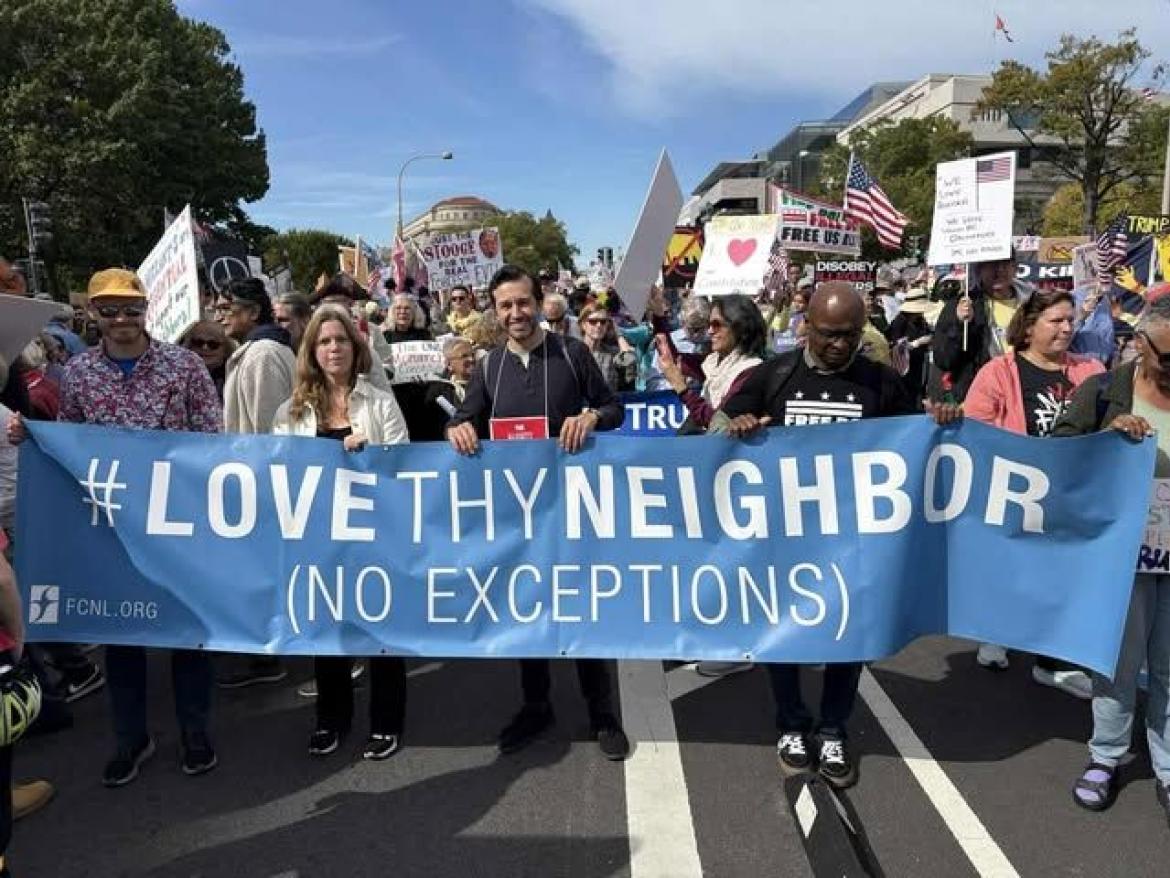March with Love Thy Neighbor banner
