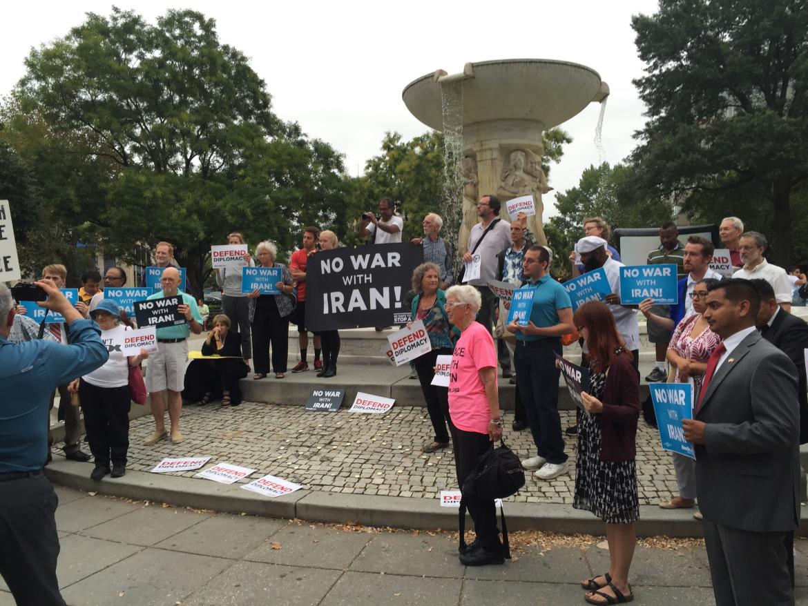 People with "No War with Iran" signs