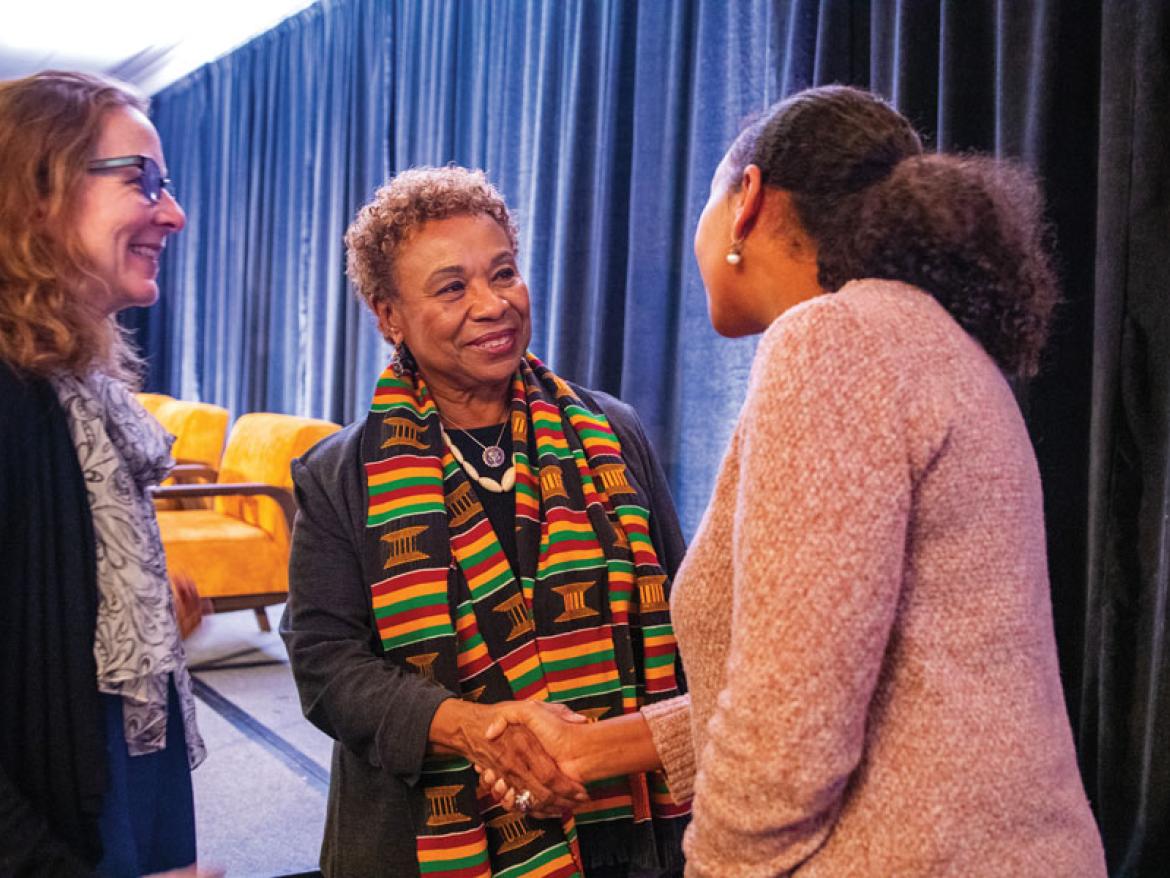 Rep. Barbara Lee shaking hands with FCNL leaders