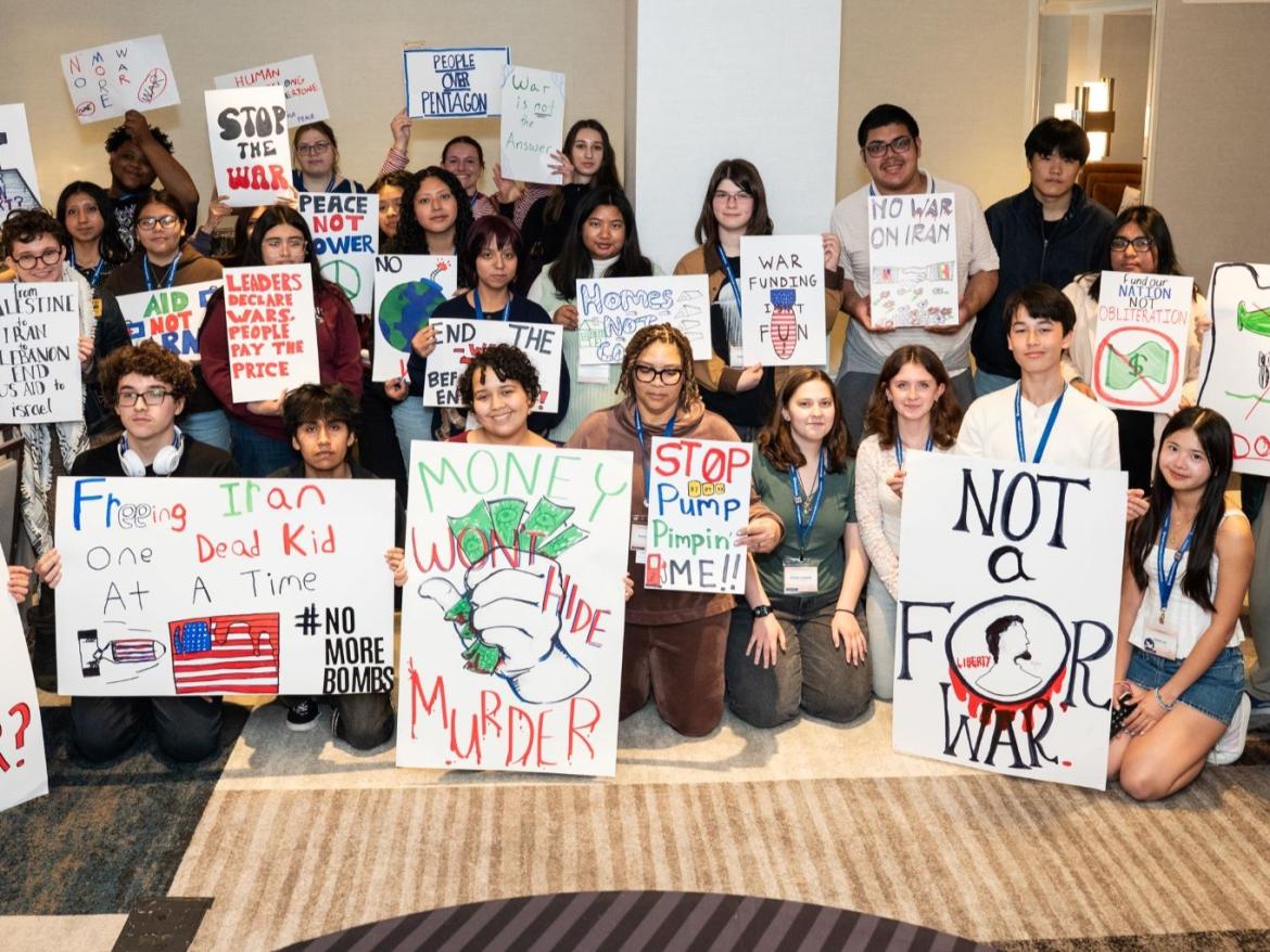 large group of people with antiwar signs