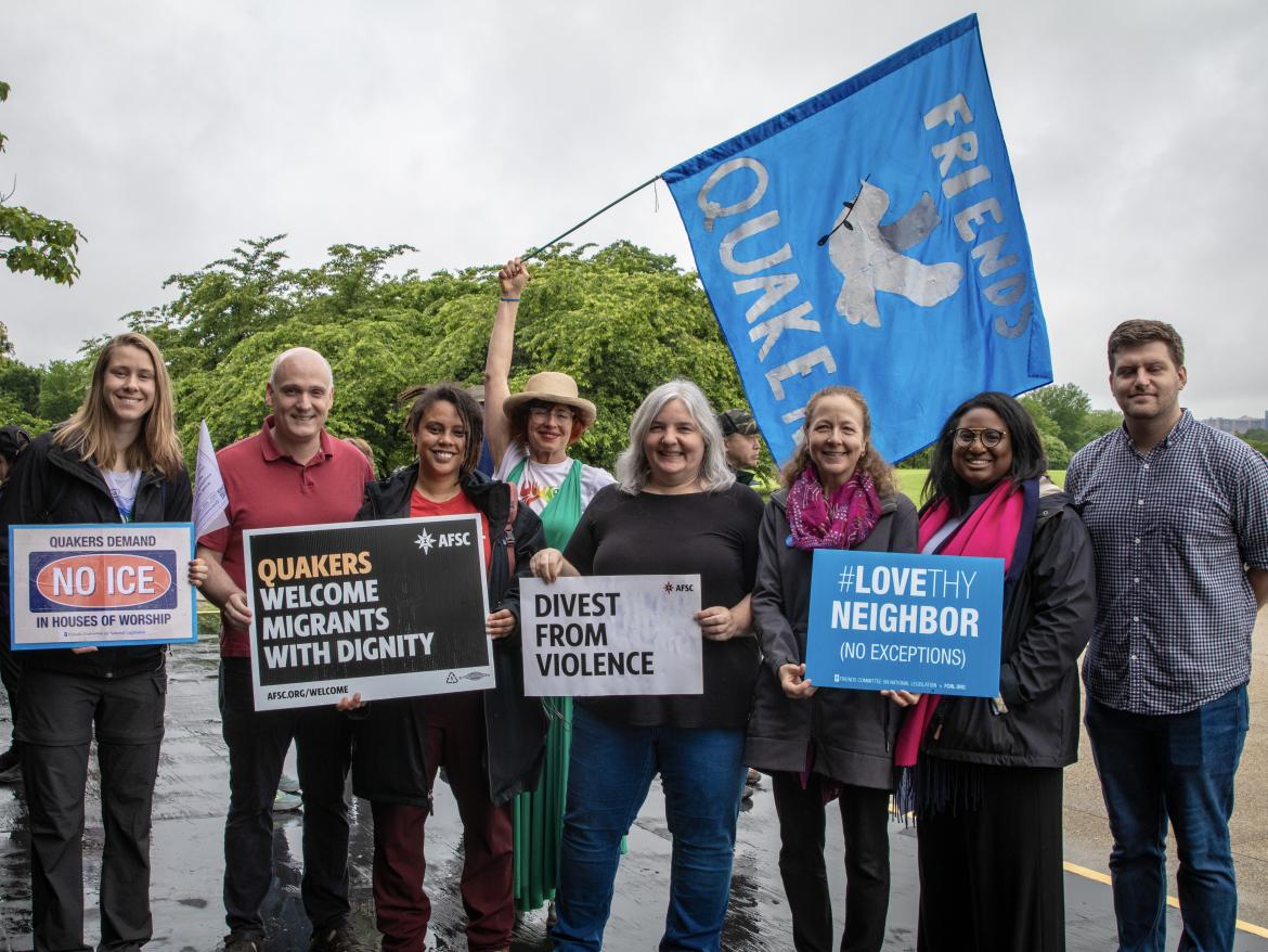 FCNL staff and Quaker advocates hold signs at Quaker Walk to Washington 