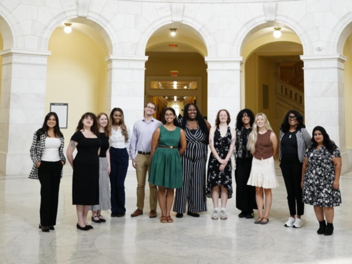 Group of young people, professionally dressed in a formal building