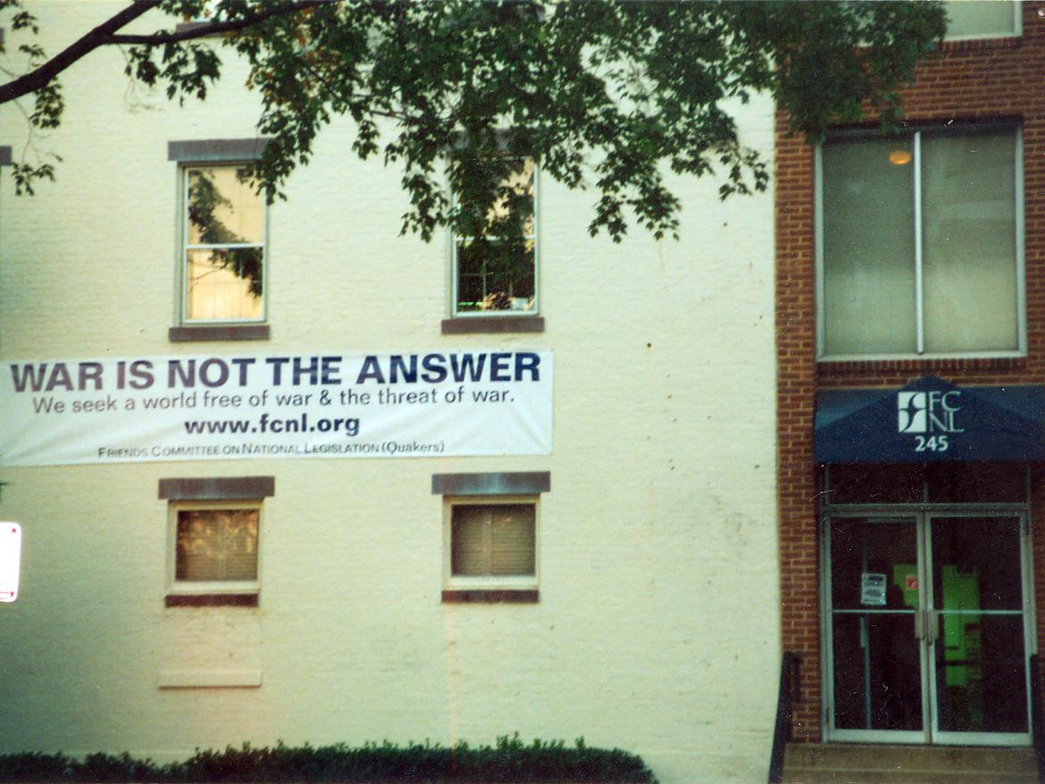 War is not the answer sign on a building