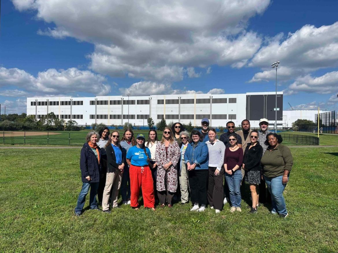 Group of people in front of a data center