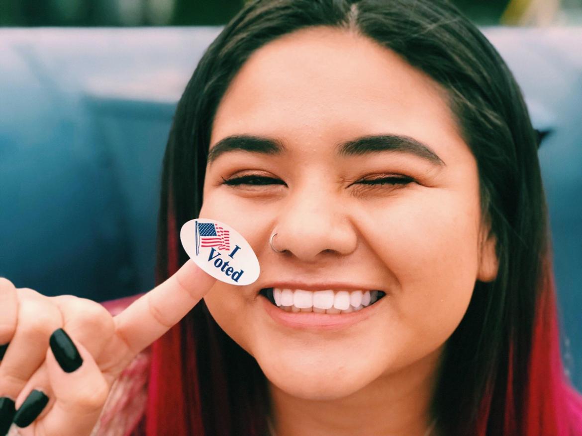 Celina Tijerina, 2018 Arkansas Advocacy Corps Organizer, with "I Voted sticker"