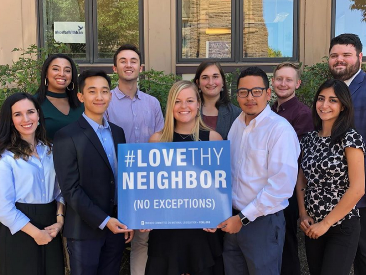 FCNL Young Fellows holding a Love They Neighbor sign