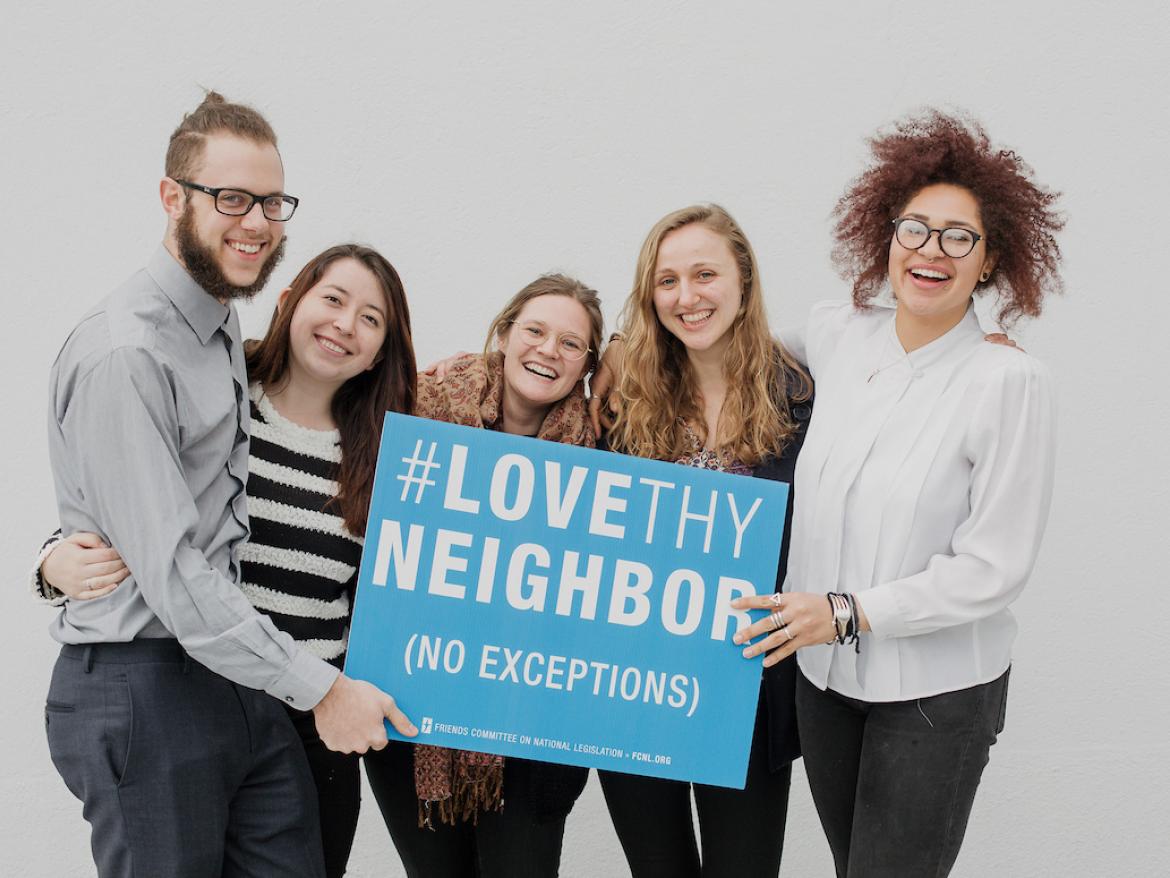 Spring Lobby Weekend Participants Holding Love They Neighbor Sign