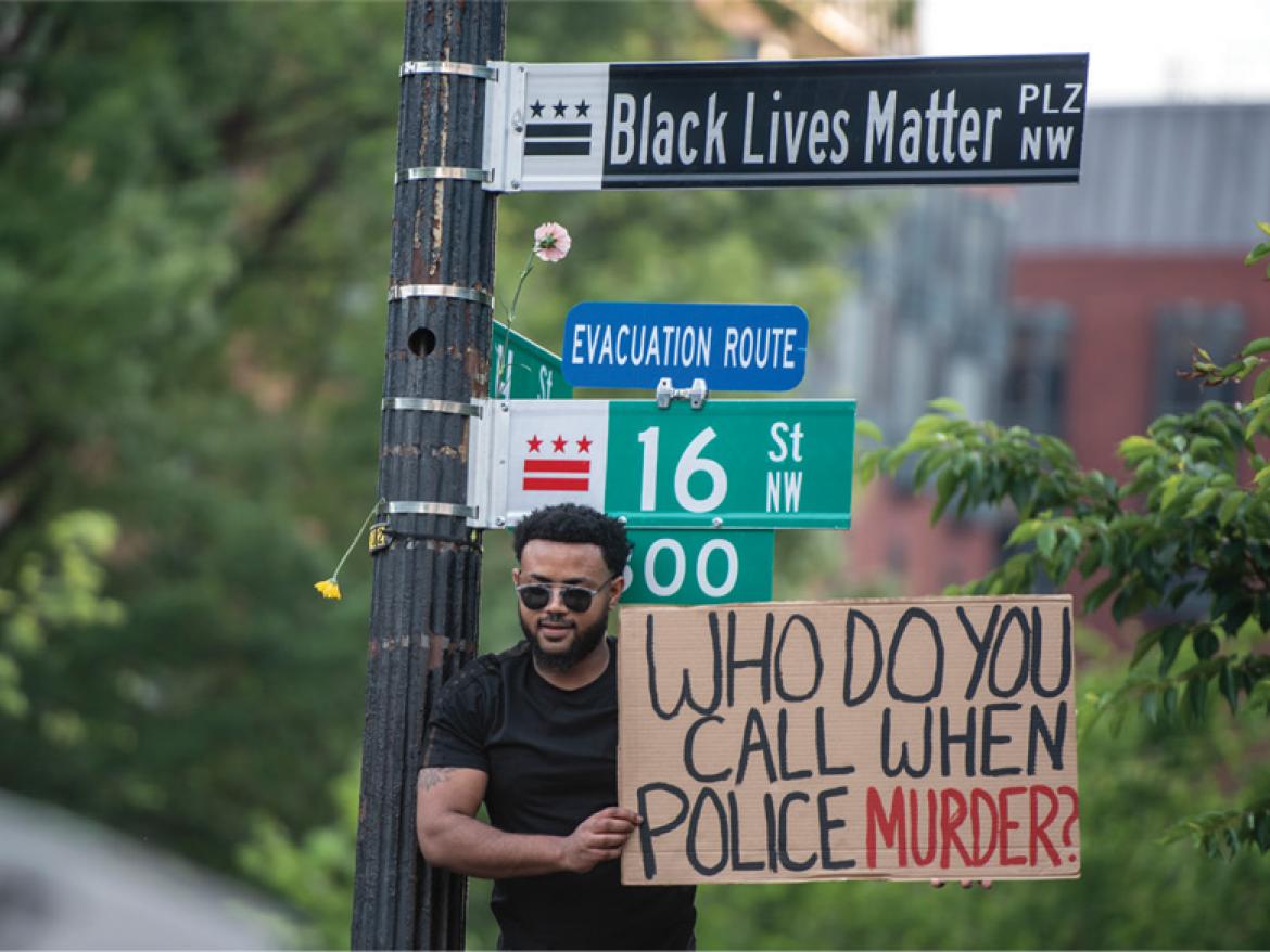 Who do you call? Protest picture.