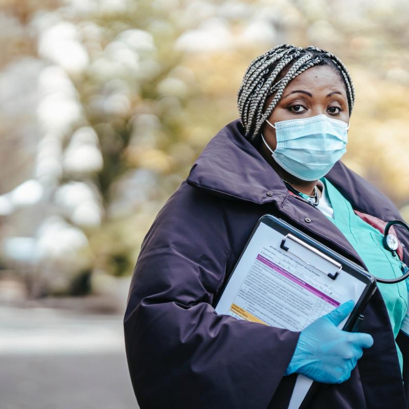 Nurse at outdoor intake center during COVID-19 pandemic