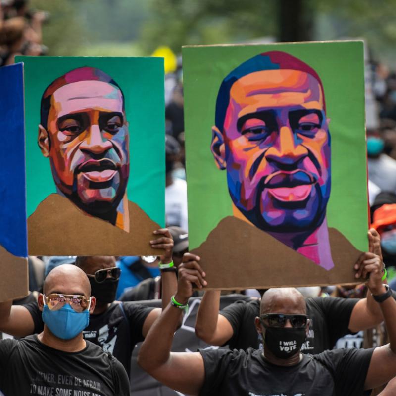 Black Lives Matter Marchers in DC hold George Floyd signs