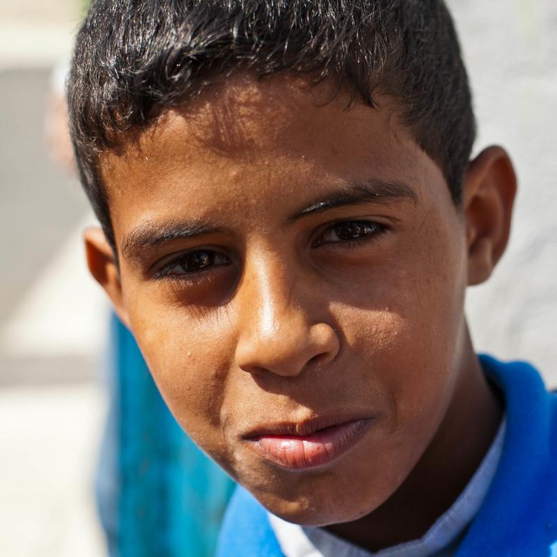   A Palestinian boy poses for a photo after school in Jarash refugee camp about an hour north of Amman in Jordan.