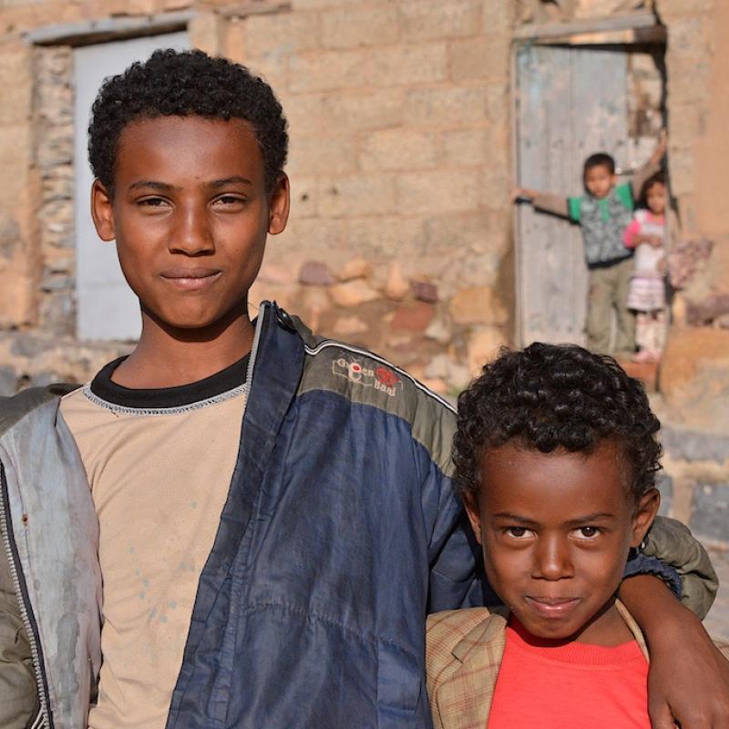 Two brothers pose in street in Mahweet, Yemen