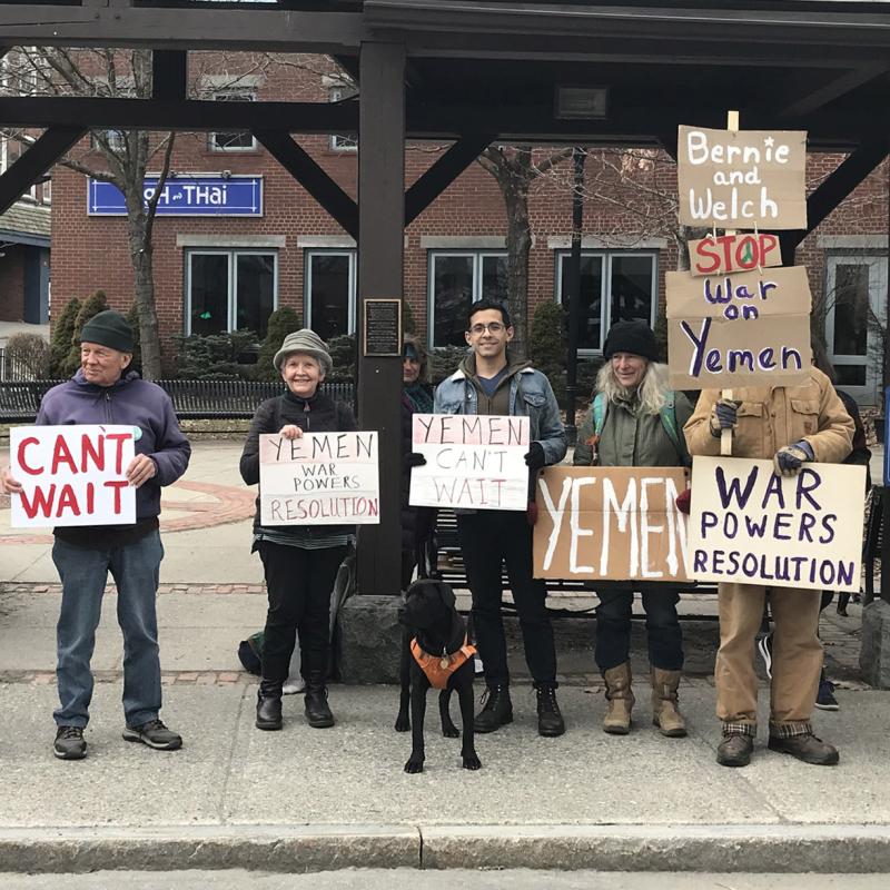 Vermont Advocacy Team members and members of a group called Action Corps hold signs that say "Yemen Can't Wait" and call for the U.S. to end its support for the war in Yemen