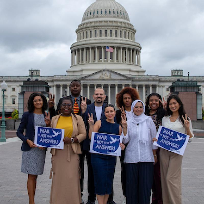 Diaspora Gathering 2024 in front of Capitol with signs saying "War is Not the Answer'