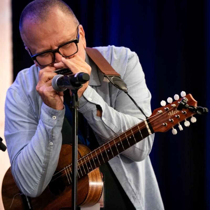A man playing harmonica