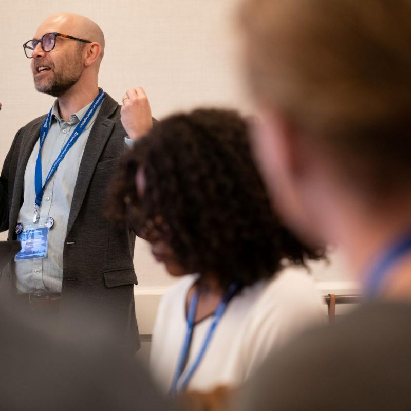 A man speaking gesturing with his hands