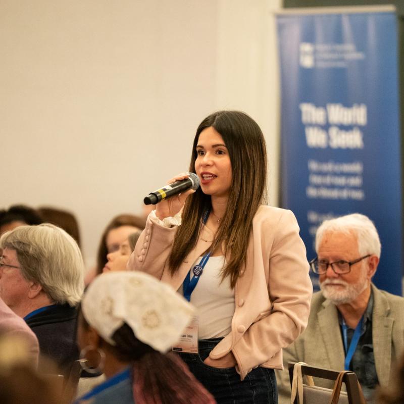 Woman at a microphone