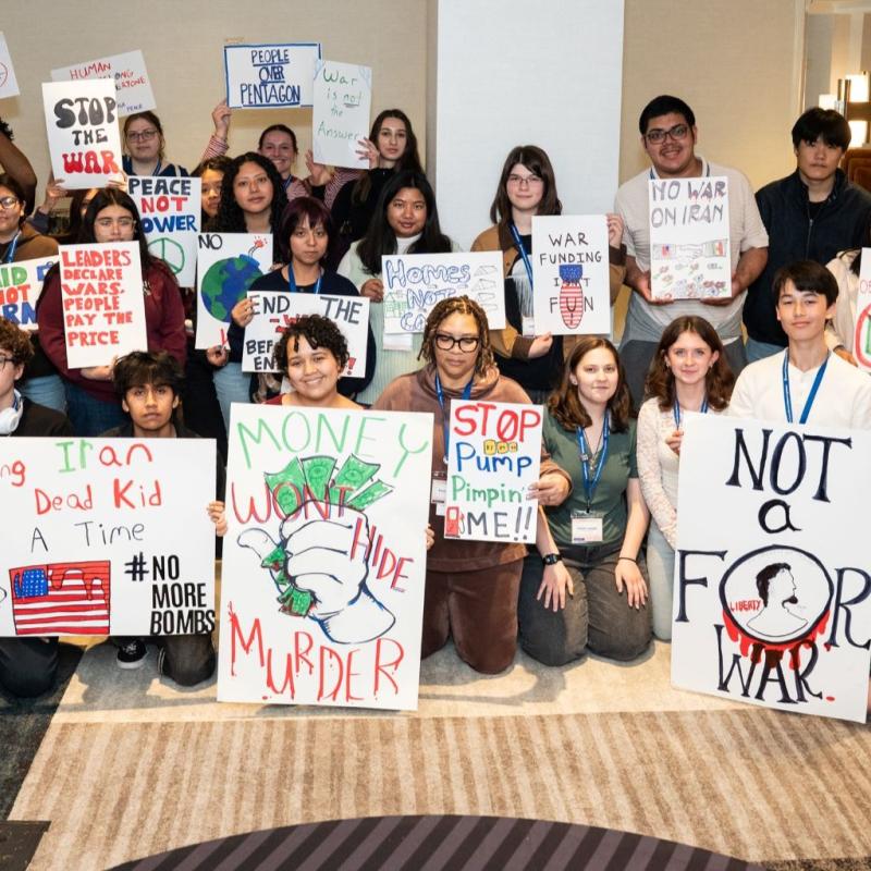 large group of people with antiwar signs