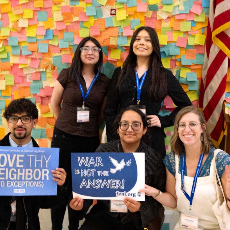 Activists with Signs in front post-it notes