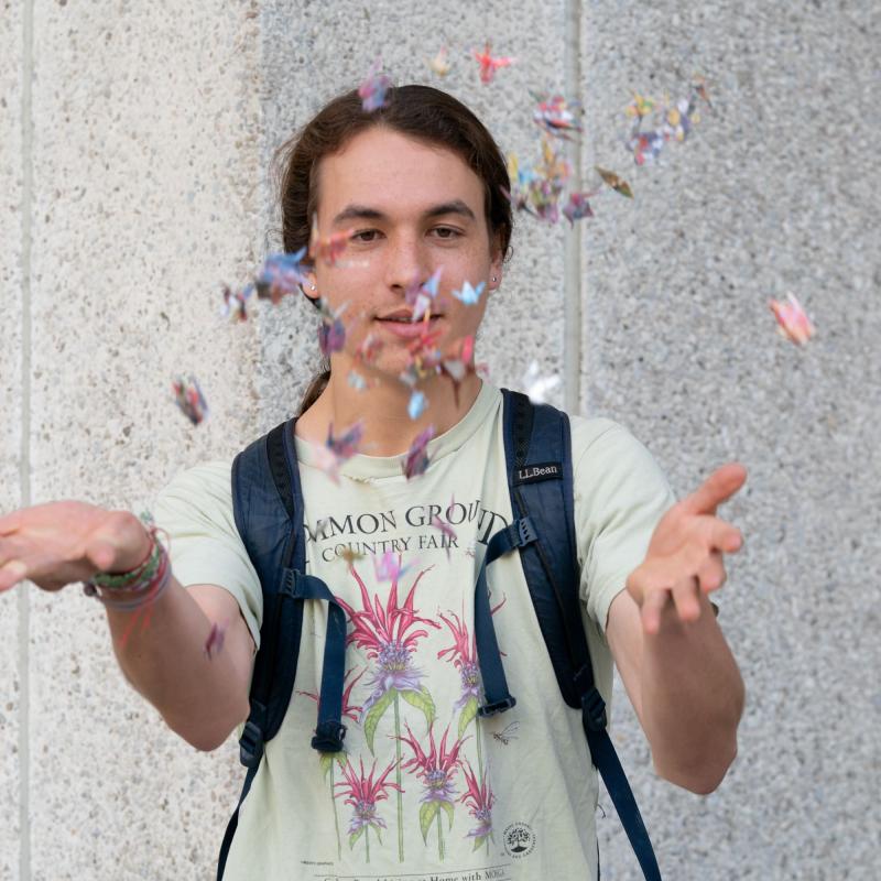 Young man throwing cranes