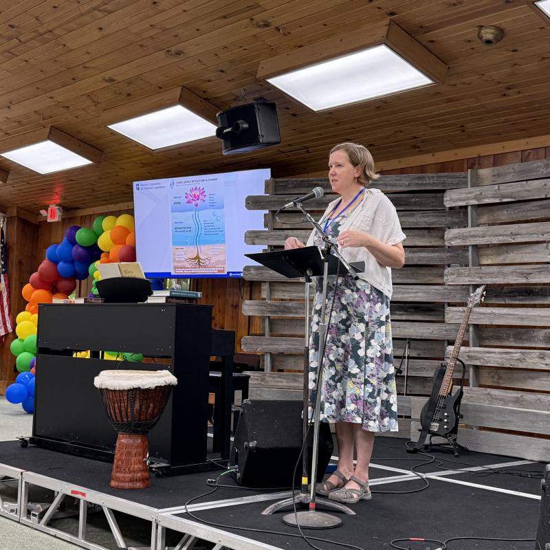 Alicia McBride speaking at a podium