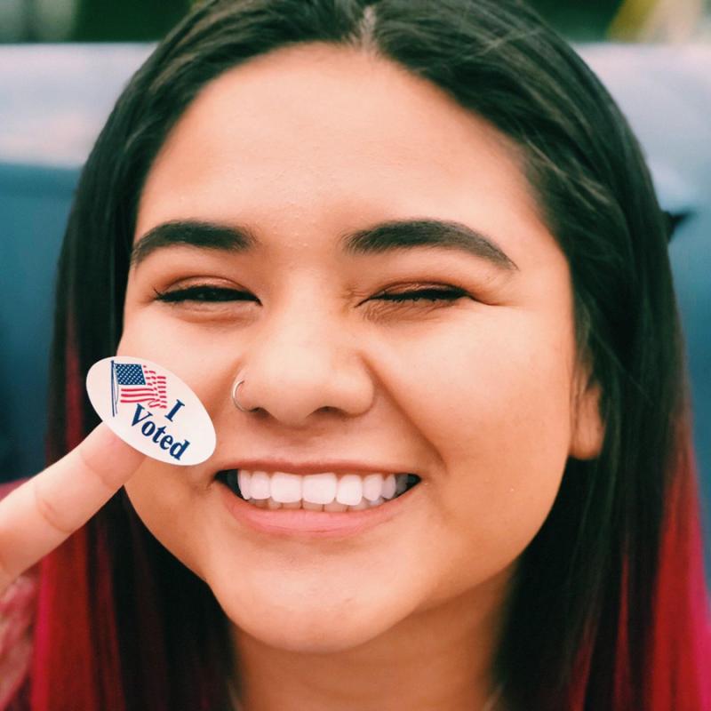 Celina Tijerina, 2018 Arkansas Advocacy Corps Organizer, with "I Voted sticker"