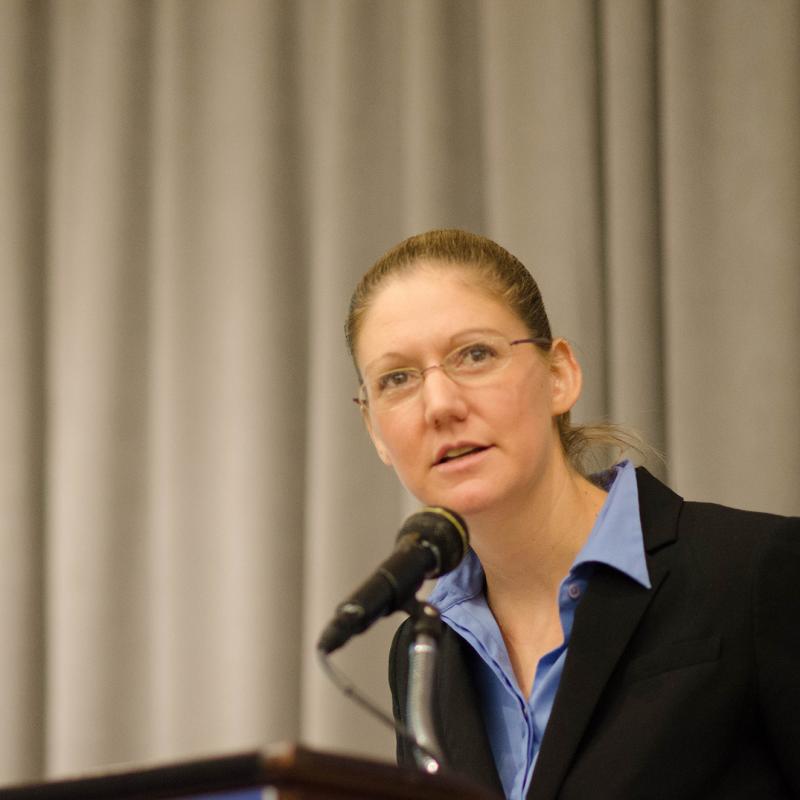 Amelia Kegan speaks at a podium