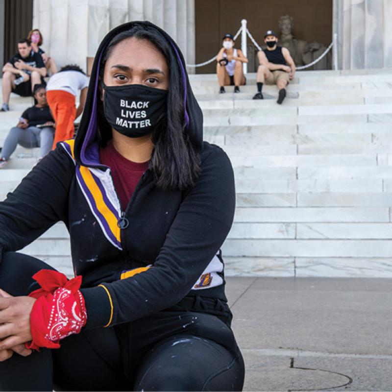 Protester in front of Lincoln Memorial.