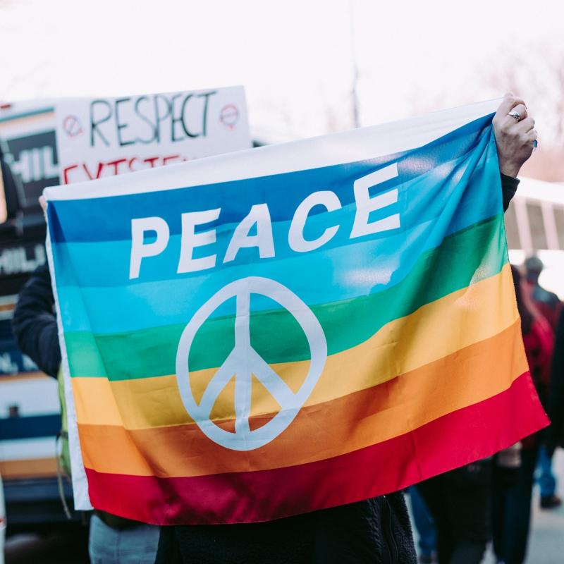 Person carrying peace flag