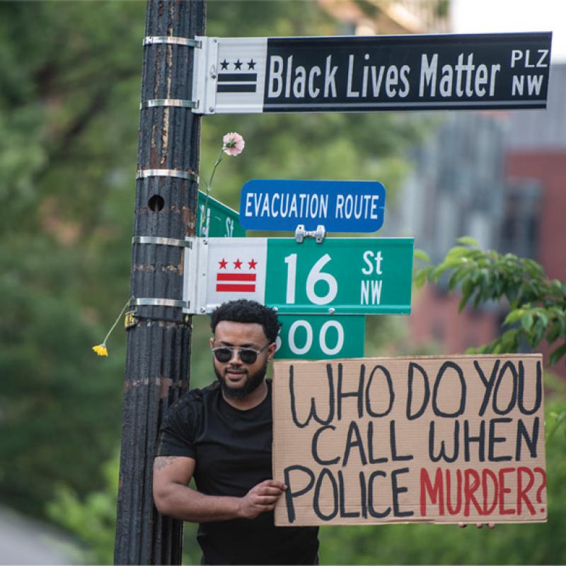 Who do you call? Protest picture.