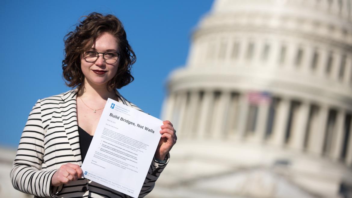 FCNL advocate holding letter to Congress in front of U.S. Capitol Building during Spring Lobby Weekend