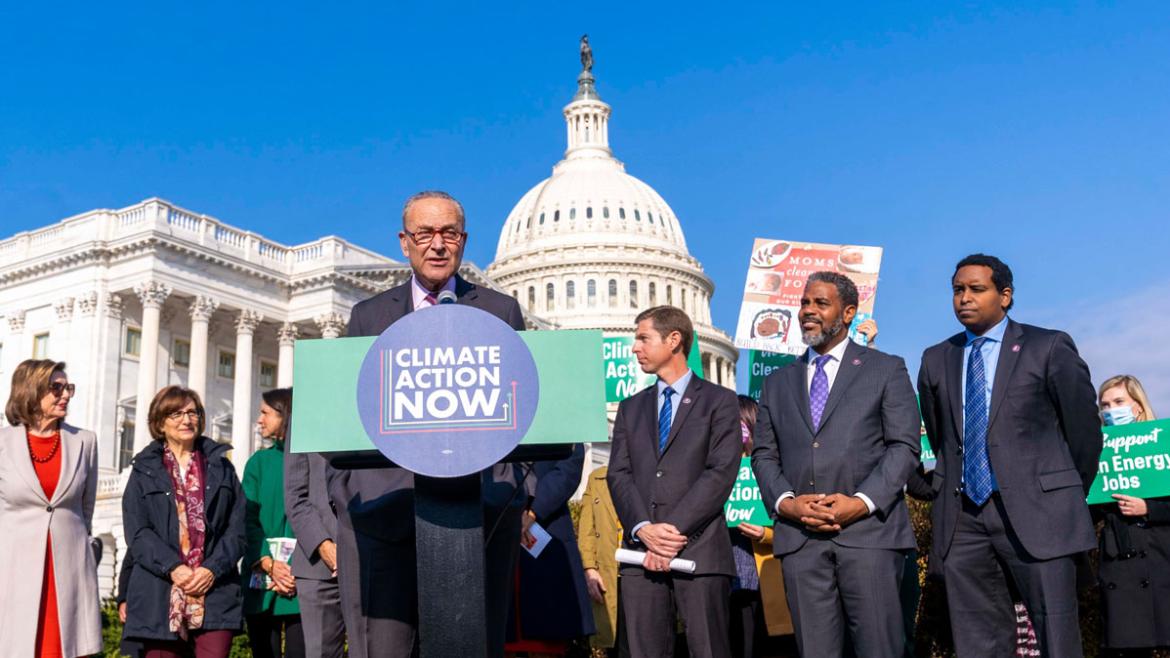 Sen. Chuck Schumer (NY) and other legislators call for climate legislation in front of U.S. Capitol.