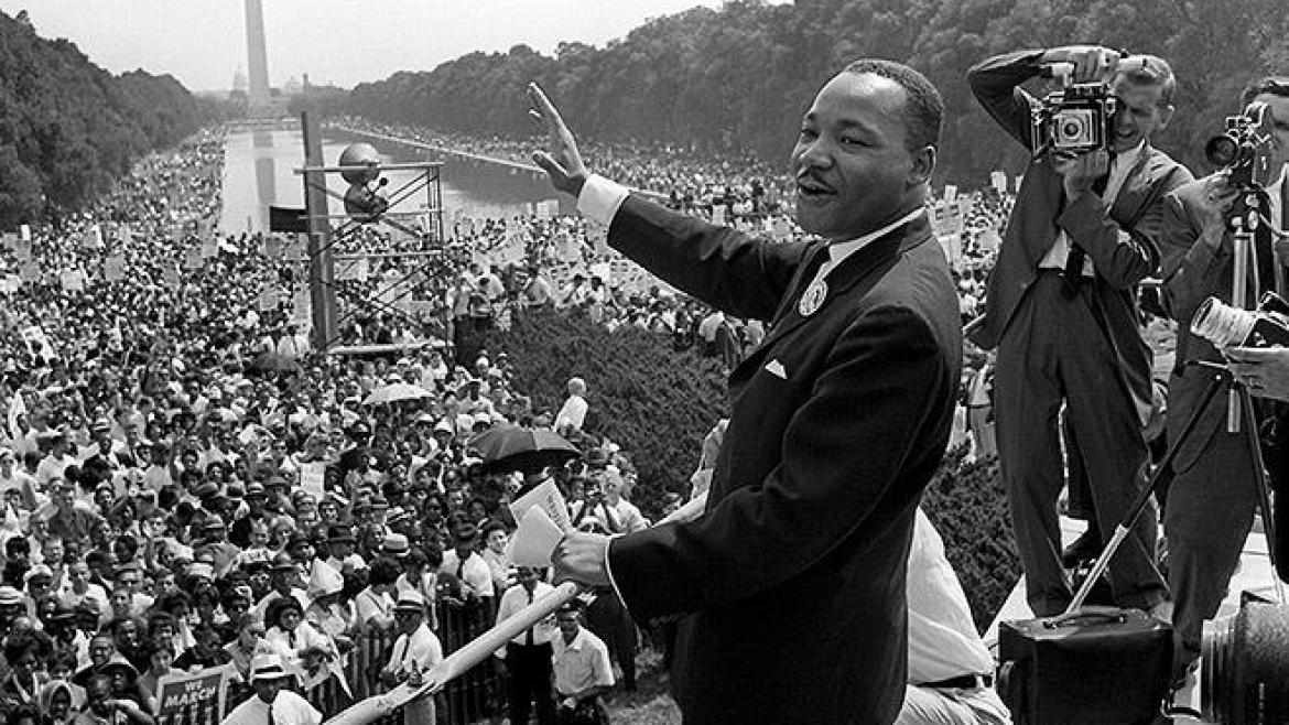 Rev. Dr. Martin Luther King Jr.waves to the croad at the March on Washington