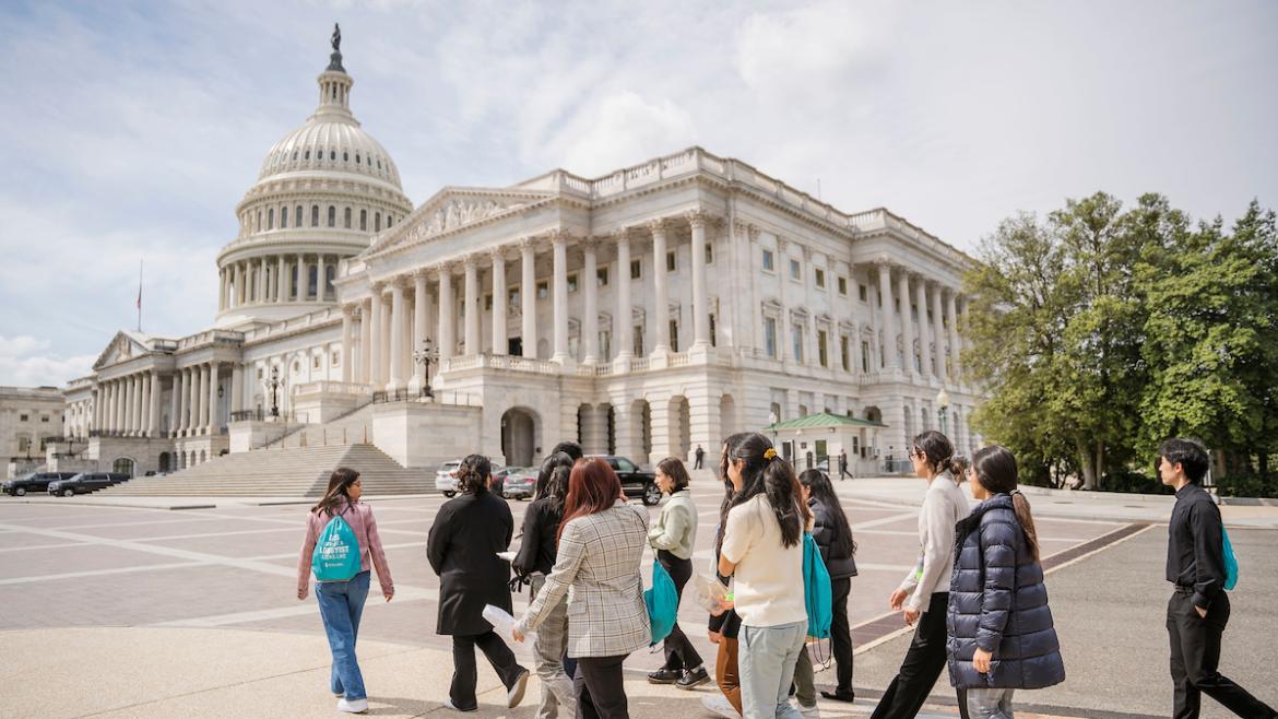 Young advocates walk toward the U.S. Capitol Building
