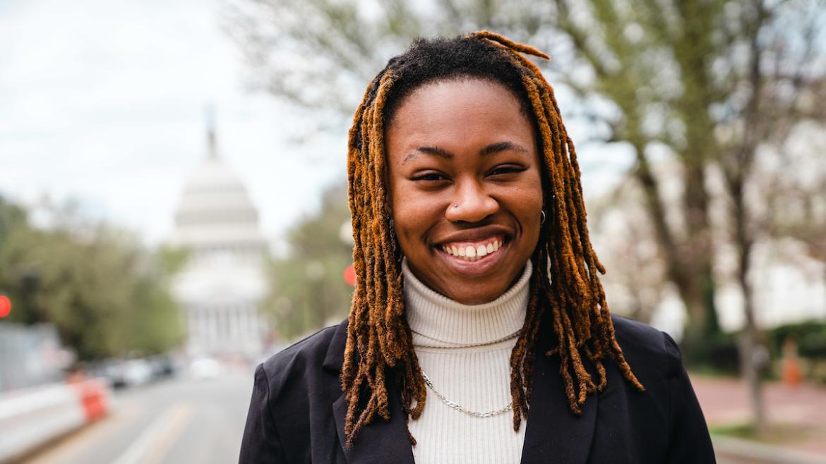 Shannon Salandy smiles in front of U.S. Capitol