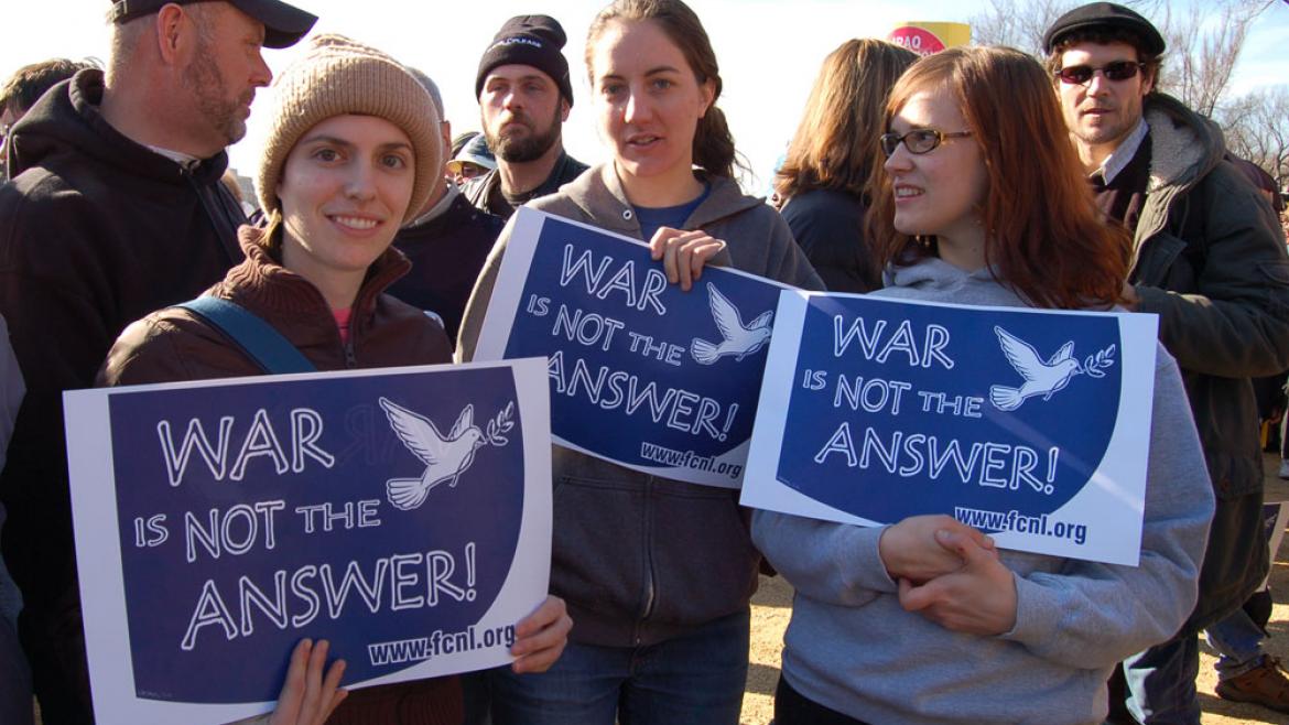 Marchers holding War is Not the Answer Signs